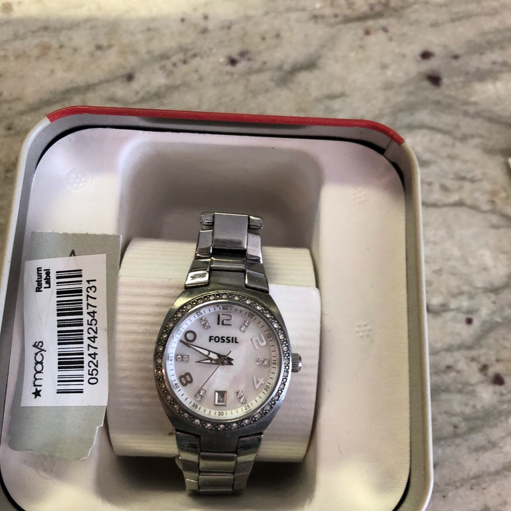 Fossil watch crystal surround with a shell face